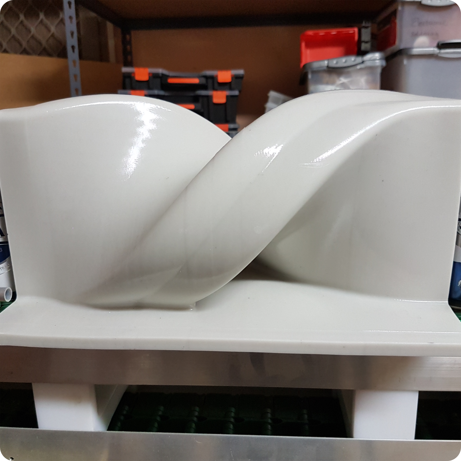 3D printed white invertor that twists beer cans 180 degrees