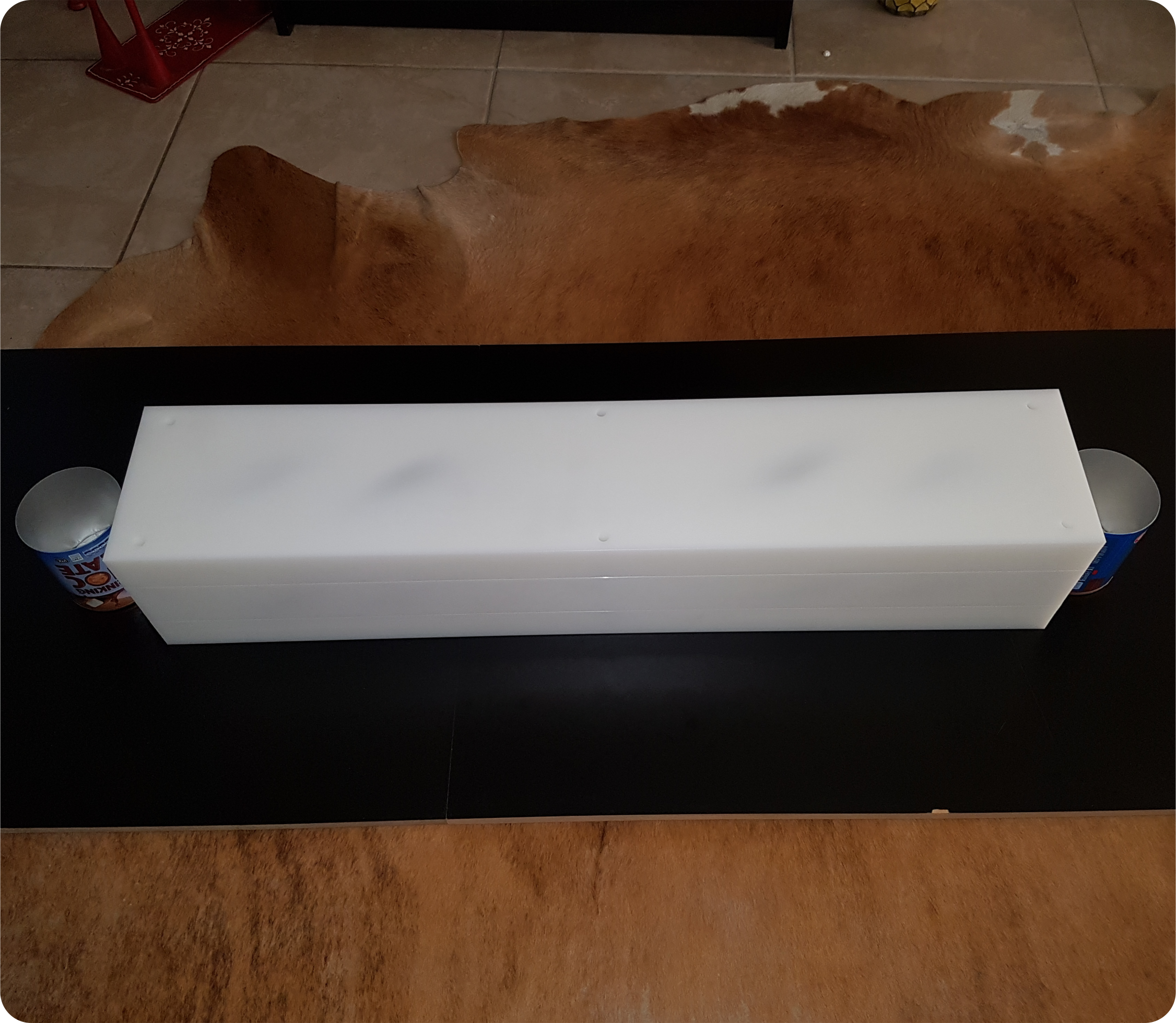 Food tin being turned upside down to be rinsed and then turned once more to be upright once again