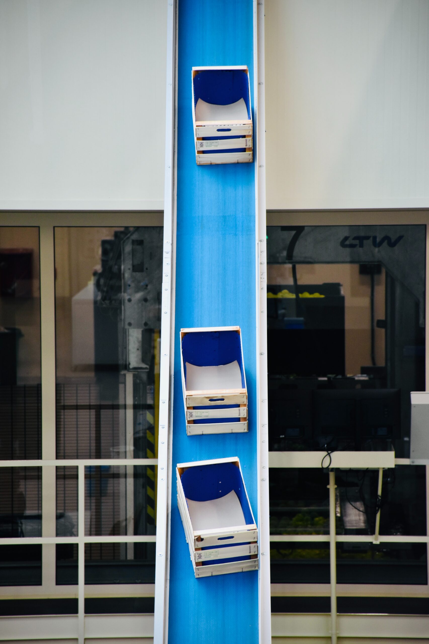 Boxes sliding down conveyor belt